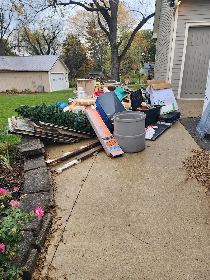 Dumpster being loaded with debris for Estate Cleanout Dumpster Rental in Blountville